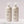 Load image into Gallery viewer, Two bottles of Neal & Wolf HYDRATE Moisture Shampoo and Conditioner, with pump dispensers, on a light background.